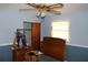 Bedroom featuring a window, closet, dresser with mirror, and wooden headboard at 5353 Shaw St, New Port Richey, FL 34652