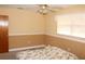 A bright bedroom with traditional decor and ceiling fan at 5353 Shaw St, New Port Richey, FL 34652