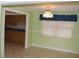 Traditional dining room with tiled floor, chandelier, and view into the kitchen at 5353 Shaw St, New Port Richey, FL 34652