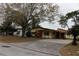 Charming single-story home with a long driveway and carport in a sunny neighborhood at 5353 Shaw St, New Port Richey, FL 34652