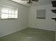 This bedroom has natural light and a ceiling fan at 6567 S West Shore Cir, Tampa, FL 33616