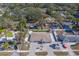 Aerial view of single-Gathering home with spacious backyard, landscaping, and paved driveway at 659 Keene Rd, Largo, FL 33771