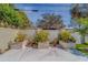 Landscaped backyard with stone planters and various plants at 659 Keene Rd, Largo, FL 33771