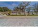 Large backyard with a spacious paver patio and a privacy fence at 659 Keene Rd, Largo, FL 33771