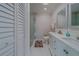 Bright bathroom featuring double vanity and a shower stall at 659 Keene Rd, Largo, FL 33771