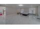 Spacious bedroom with marble floors and a comfortable bed at 659 Keene Rd, Largo, FL 33771