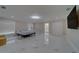 Spacious bedroom with marble floors, a large bed, and ensuite access at 659 Keene Rd, Largo, FL 33771