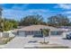 Newly renovated home with a large driveway and fenced yard at 659 Keene Rd, Largo, FL 33771