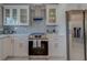 Modern kitchen with stainless steel appliances and white cabinetry at 659 Keene Rd, Largo, FL 33771