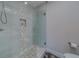 Modern shower with glass enclosure and mosaic tile at 659 Keene Rd, Largo, FL 33771