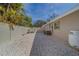 Gravel side yard with storage tank and AC units at 659 Keene Rd, Largo, FL 33771