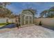 Green storage shed in the backyard at 659 Keene Rd, Largo, FL 33771