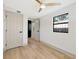 Light-filled bedroom with ceiling fan and hardwood floors at 664 60Th S St, St Petersburg, FL 33707