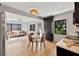 Open concept dining area with glass table and modern chairs at 664 60Th S St, St Petersburg, FL 33707