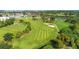 Aerial view of a lush green golf course near marina at 664 60Th S St, St Petersburg, FL 33707