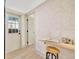 Hallway with exterior door and wood floors at 664 60Th S St, St Petersburg, FL 33707