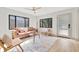 Living room with a leather couch and mid-century modern decor at 664 60Th S St, St Petersburg, FL 33707