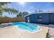 Inviting kidney-shaped pool in the backyard at 664 60Th S St, St Petersburg, FL 33707