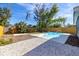 Relaxing kidney-shaped pool in backyard at 664 60Th S St, St Petersburg, FL 33707