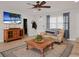 Inviting living room with neutral tones and a view towards the front entrance and hallway at 6702 Harbor Dr, Hudson, FL 34667