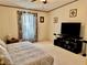 Serene bedroom with a large bed, TV, and ample space at 8326 Fantasia Park Way, Riverview, FL 33578