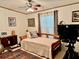 Guest bedroom with daybed, ceiling fan, and exercise bike at 8326 Fantasia Park Way, Riverview, FL 33578