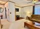 Living room with brown sofa and wood coffee table at 8326 Fantasia Park Way, Riverview, FL 33578