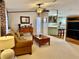 Open living room with view into kitchen and fireplace at 8326 Fantasia Park Way, Riverview, FL 33578