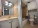 Bathroom features a toilet, tub, and vanity with mirror at 9011 Westchester Cir # 24, Tampa, FL 33604