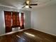 Bright bedroom with wood-look floors and large window at 9011 Westchester Cir # 24, Tampa, FL 33604