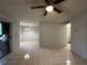 Spacious living room with tile flooring and ceiling fan at 9011 Westchester Cir # 24, Tampa, FL 33604