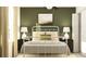 Bedroom with a white metal bed frame and green accents at 9390 Runaway Breeze Dr, Land O Lakes, FL 34637