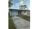 Backyard view features a garage and small patio. Ready for your ideas at 477 88Th N Ave, St Petersburg, FL 33702