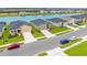 Aerial view of a lakefront community with new homes at 10023 Eventide Trl, Parrish, FL 34219