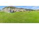 Large grassy backyard with lake view at 10023 Eventide Trl, Parrish, FL 34219