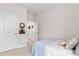 Spacious bedroom with a bed and access to hallway at 10023 Eventide Trl, Parrish, FL 34219