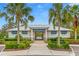 Community pool house with palm trees and lush landscaping at 10023 Eventide Trl, Parrish, FL 34219