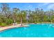 Inviting community pool with lush landscaping at 10023 Eventide Trl, Parrish, FL 34219