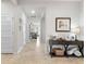 Bright and airy foyer with tile floors and views of the living room at 10023 Eventide Trl, Parrish, FL 34219