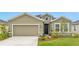 Single-Gathering home with two-car garage and landscaped yard at 10023 Eventide Trl, Parrish, FL 34219
