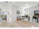 Game room with a pinball machine, desk, and shelving at 10023 Eventide Trl, Parrish, FL 34219