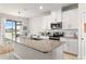 Modern kitchen with granite countertops and stainless steel appliances at 10023 Eventide Trl, Parrish, FL 34219