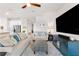 Spacious living room with comfortable seating and large TV at 10023 Eventide Trl, Parrish, FL 34219