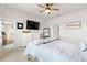 Main bedroom with access to dining area and neutral decor at 10023 Eventide Trl, Parrish, FL 34219