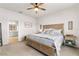 Main bedroom with ensuite bathroom and neutral decor at 10023 Eventide Trl, Parrish, FL 34219