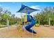 Community playground with shaded play structures and slides at 10023 Eventide Trl, Parrish, FL 34219