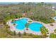 Community pool with lounge chairs and surrounding landscaping at 10023 Eventide Trl, Parrish, FL 34219