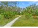 Paved walking trail winding through lush foliage at 10023 Eventide Trl, Parrish, FL 34219