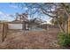 Screened pool and patio in backyard with wood fence at 11162 Libby Rd, Spring Hill, FL 34609