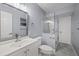 Updated bathroom with a walk-in shower and gray walls at 11162 Libby Rd, Spring Hill, FL 34609